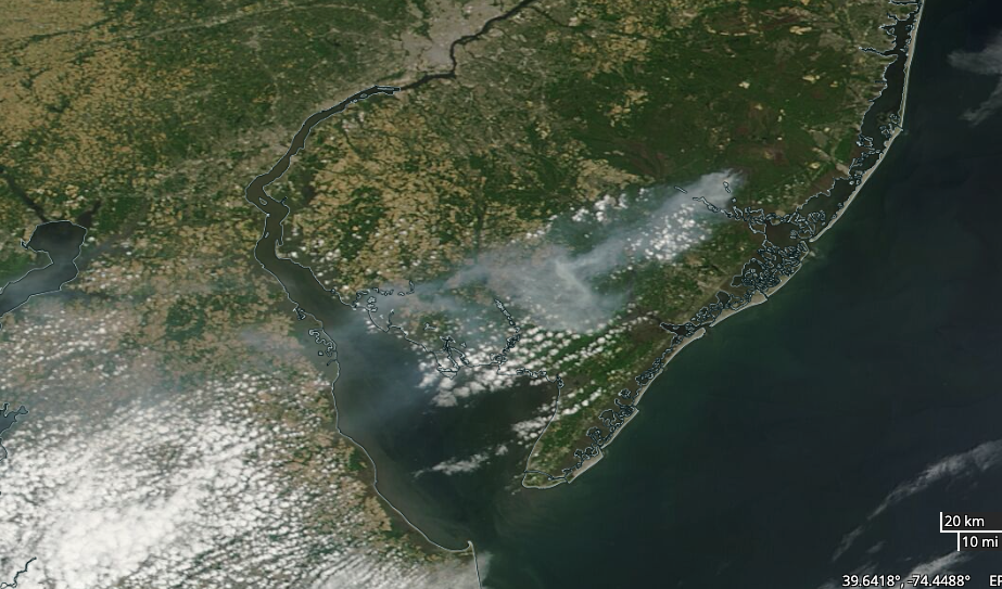 MODIS Terra visible satellite image at approximately 10 AM on June 1 showing grey smoke from the Bass River fire drifting southwestward over south Jersey, Delaware Bay, and central Delaware.