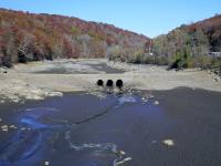 A dry Oak Ridge Reservoir (Morris County) on October 24th, 2024, revealing a "ghost bridge" that had been used by stagecoaches on the original roadbed of the Paterson-Hamburg Turnpike. Photo by Andre Malok/NJ.com.