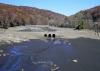 A dry Oak Ridge Reservoir (Morris County) on October 24th, 2024, revealing a "ghost bridge" that had been used by stagecoaches on the original roadbed of the Paterson-Hamburg Turnpike. Photo by Andre Malok/NJ.com.