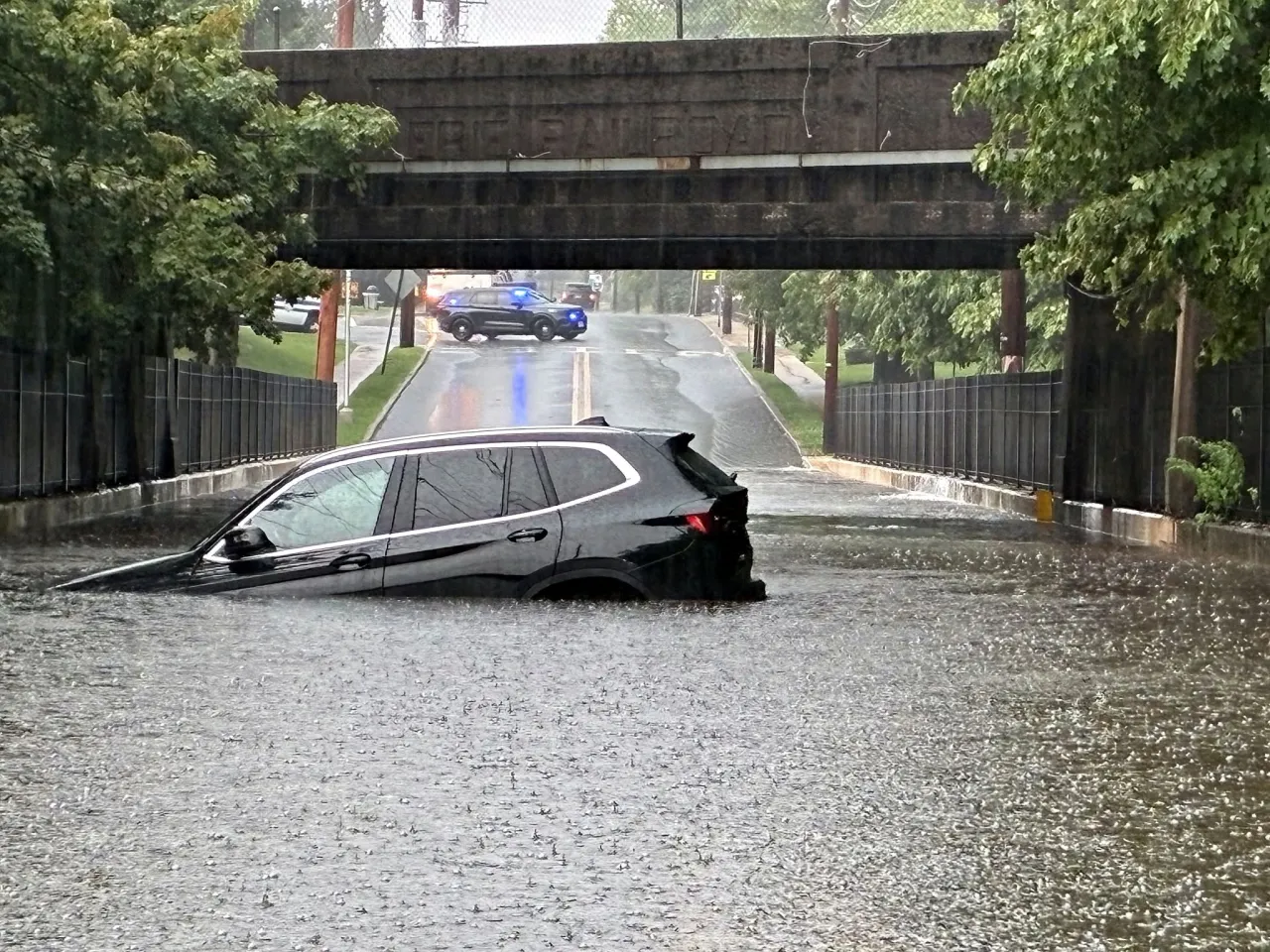 Photo showing a vehicle trapped in flood waters in Glen Rock on July 27. 
